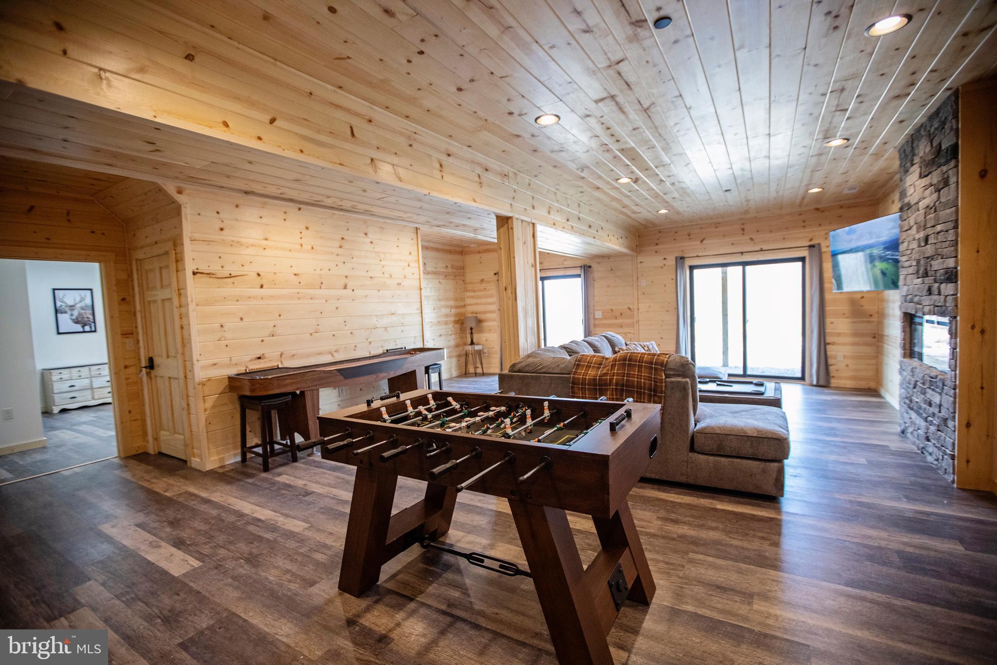 635 Biltmore Rdg Trail McHenry, MD 21541 - Photo 39 of 64 a living room with furniture a fireplace and wooden floor