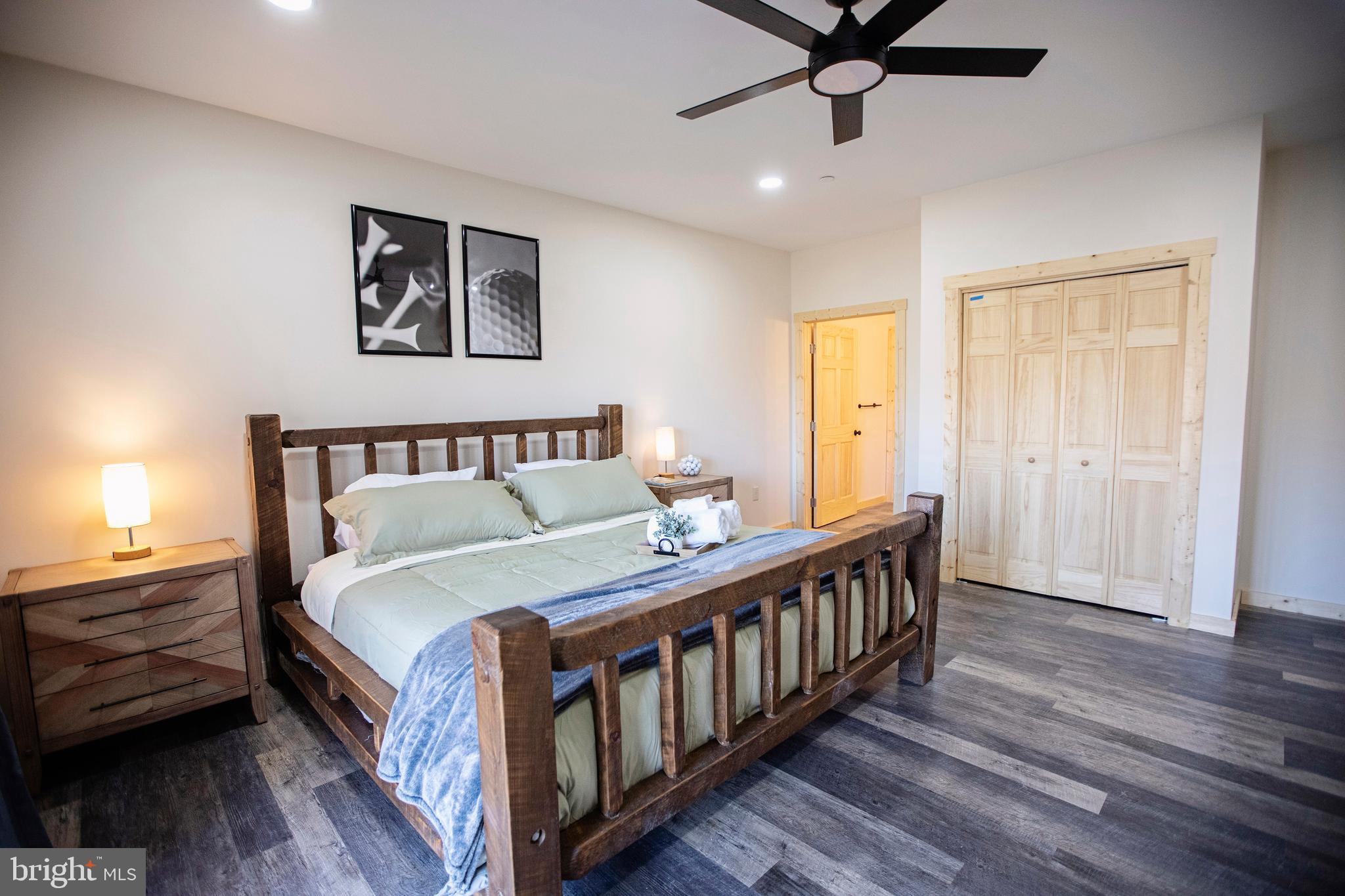 635 Biltmore Rdg Trail McHenry, MD 21541 - Photo 42 of 64 a bedroom with a bed and wooden floor