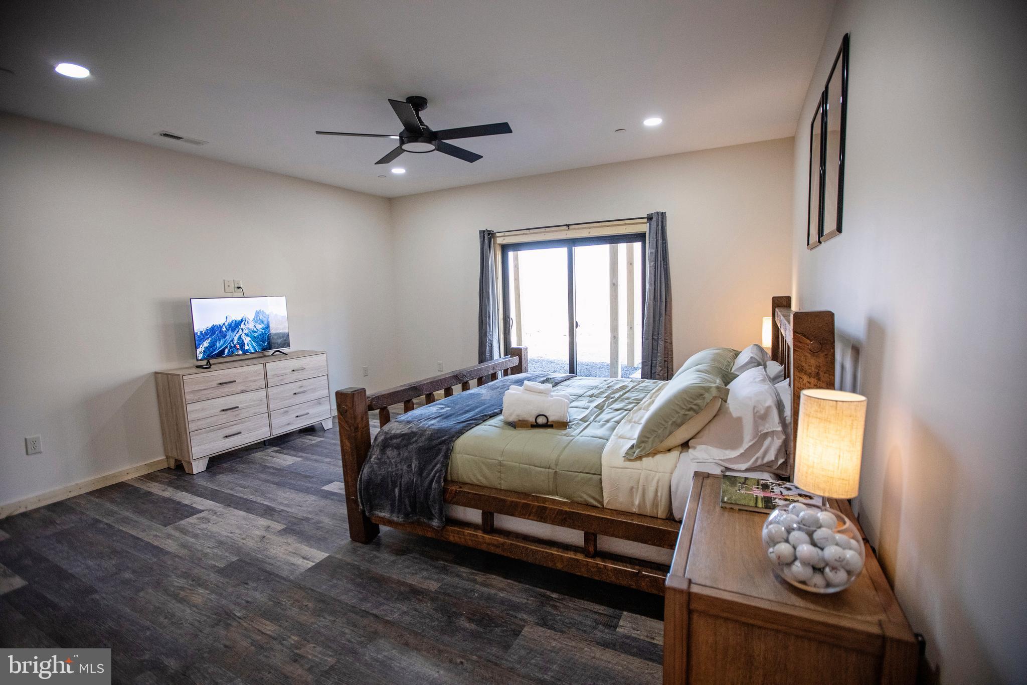 635 Biltmore Rdg Trail McHenry, MD 21541 - Photo 45 of 64 a bedroom with a bed and a chandelier