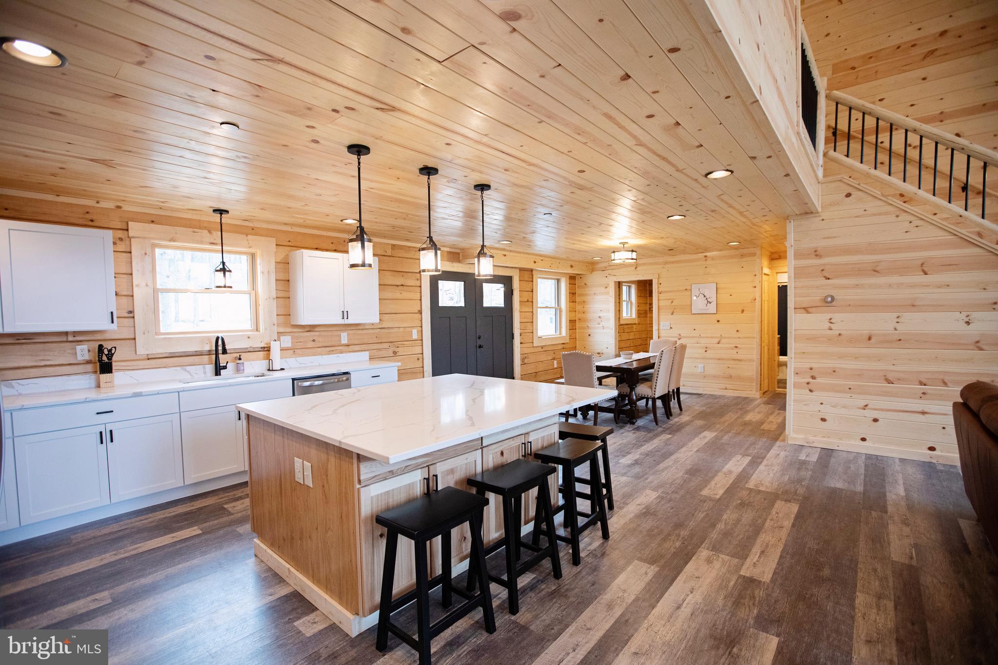 635 Biltmore Rdg Trail McHenry, MD 21541 - Photo 9 of 64 a large kitchen with lots of counter space wooden floor and stainless steel appliances