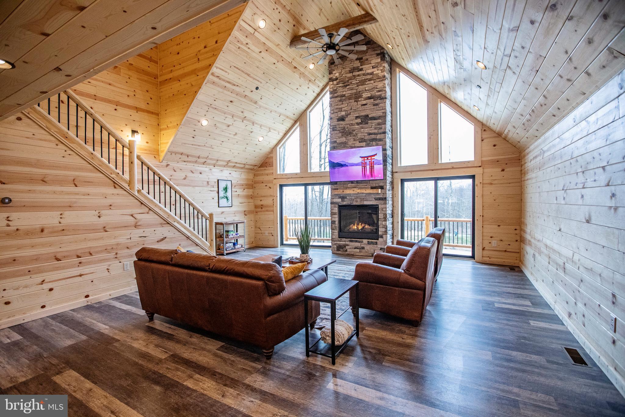 635 Biltmore Rdg Trail McHenry, MD 21541 - Photo 10 of 64 a living room with fireplace furniture and a wooden floor