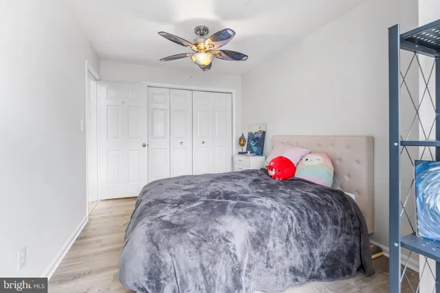 a living room with a bed and a chandelier