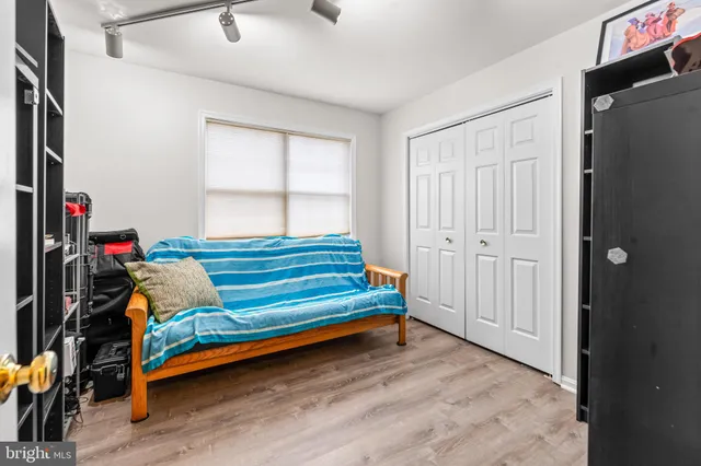 a bedroom with bed and a window