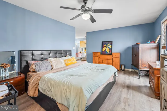 a bed room with a bed and a chandelier