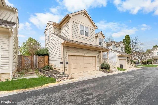 a view of a house with a yard and garage