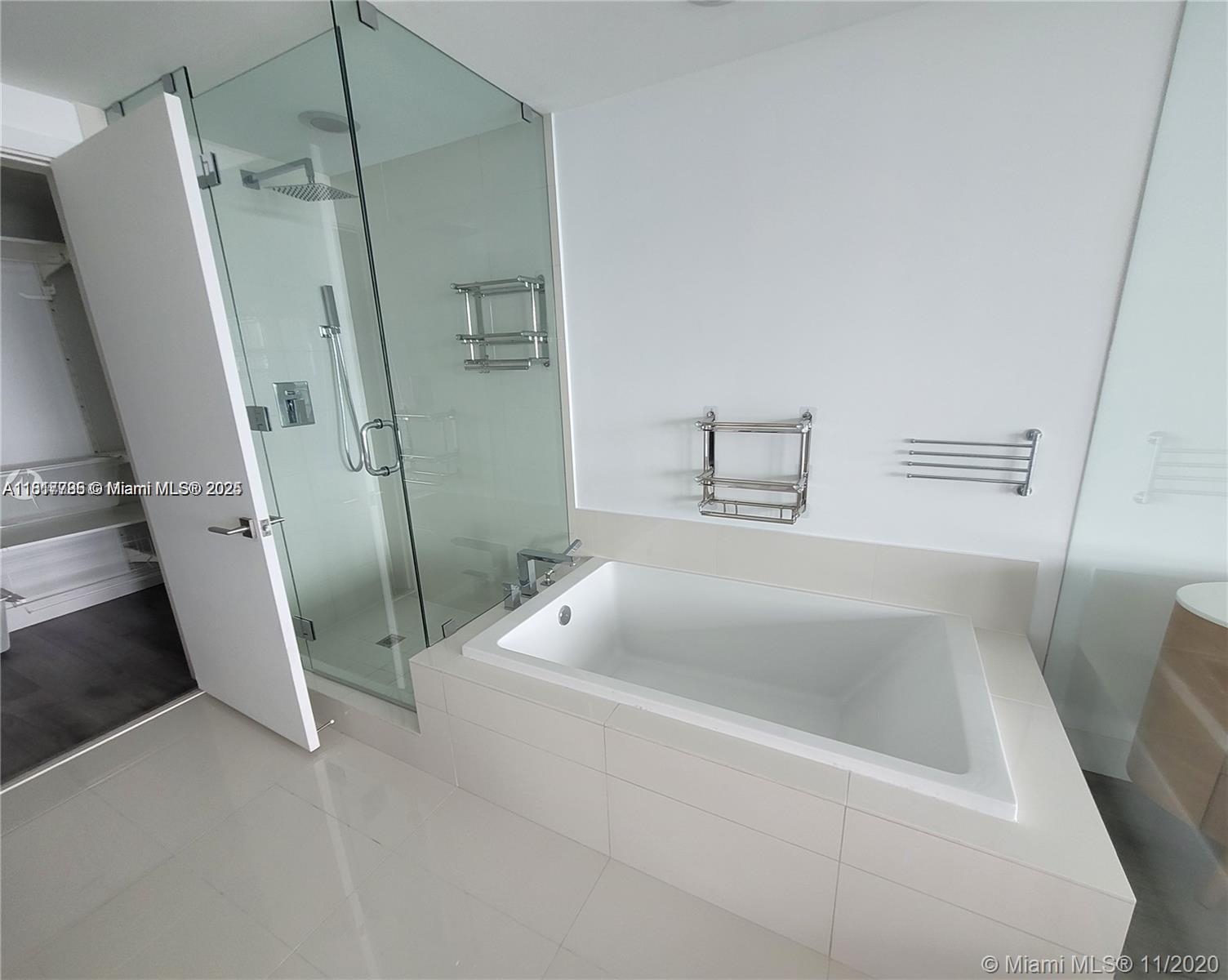 Edgewater Miami, FL 33137 - Photo 9 of 11 a bathroom with a tub and sink
