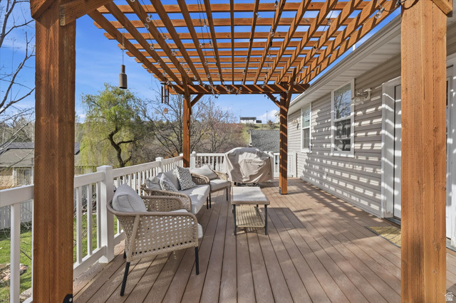 353 Robin Street Smithfield, UT 84335 - Photo 42 of 70 Wooden terrace with an outdoor lounge area and a pergola