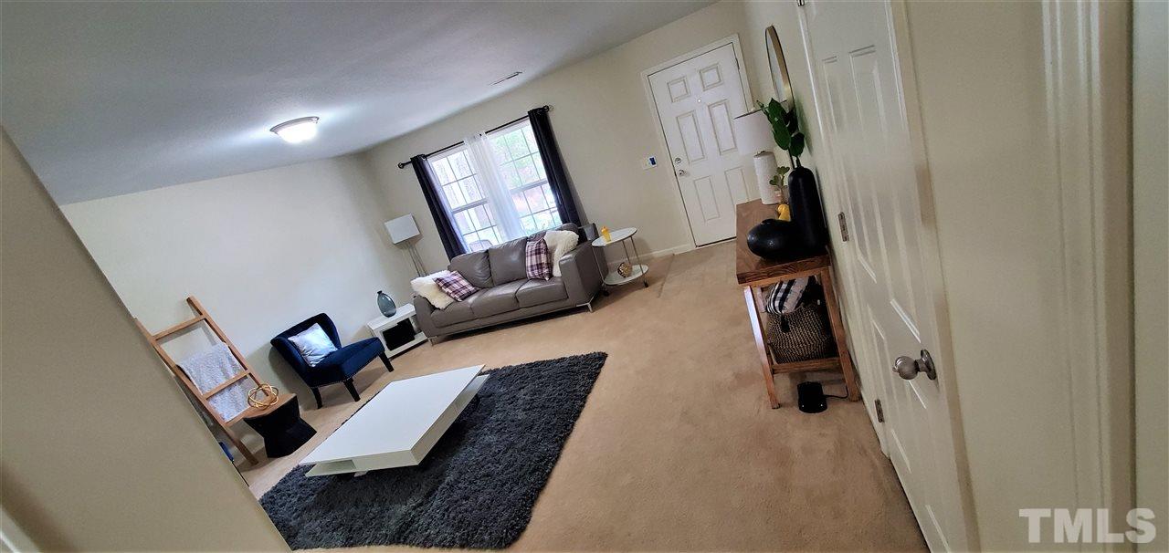 2737 Manthorp Terrace Raleigh, NC 27610 - Photo 6 of 21 a living room with furniture and a window
