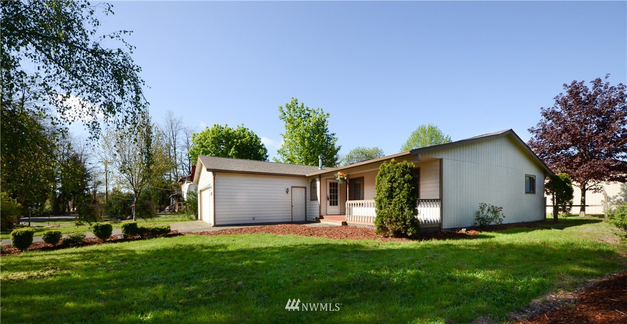 17707 Jordan Street Southwest Rochester, WA 98579 - Photo 2 of 23 a view of a backyard with plants and a garden