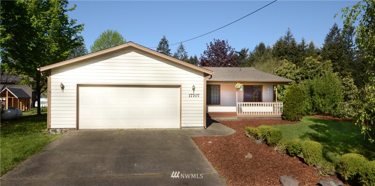 17707 Jordan Street Southwest Rochester, WA 98579 - Photo 23 of 23 a view of a house with a yard and garage
