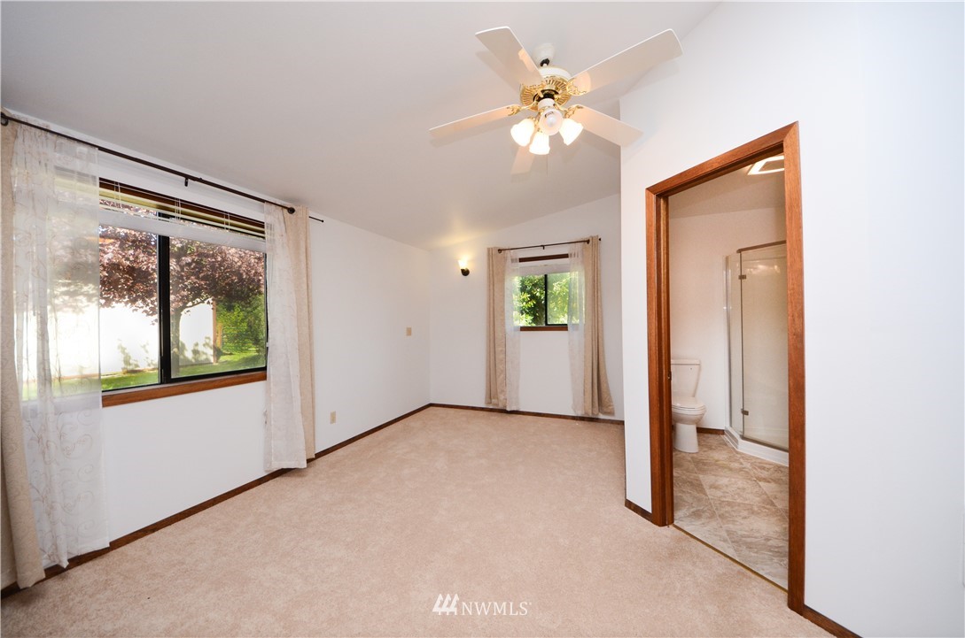 17707 Jordan Street Southwest Rochester, WA 98579 - Photo 9 of 23 wooden floor in an empty room with a window