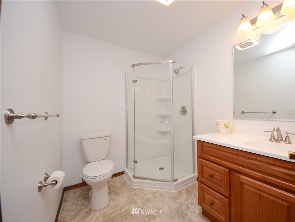 17707 Jordan Street Southwest Rochester, WA 98579 - Photo 10 of 23 a bathroom with a granite countertop sink toilet and shower