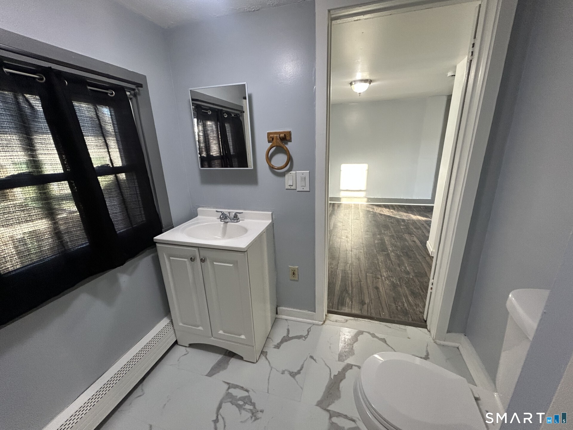 288 Litchfield Street, Unit 2 Torrington, CT 06790 - Photo 14 of 15 a bathroom with a sink toilet and shower