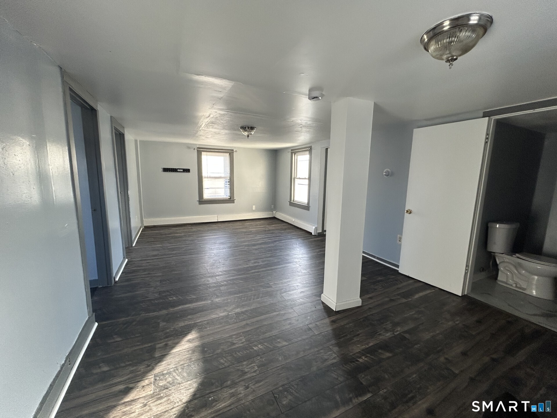 288 Litchfield Street, Unit 2 Torrington, CT 06790 - Photo 6 of 15 a view of gallery with wooden floor