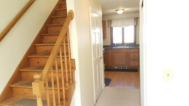 a view of a hallway with staircase