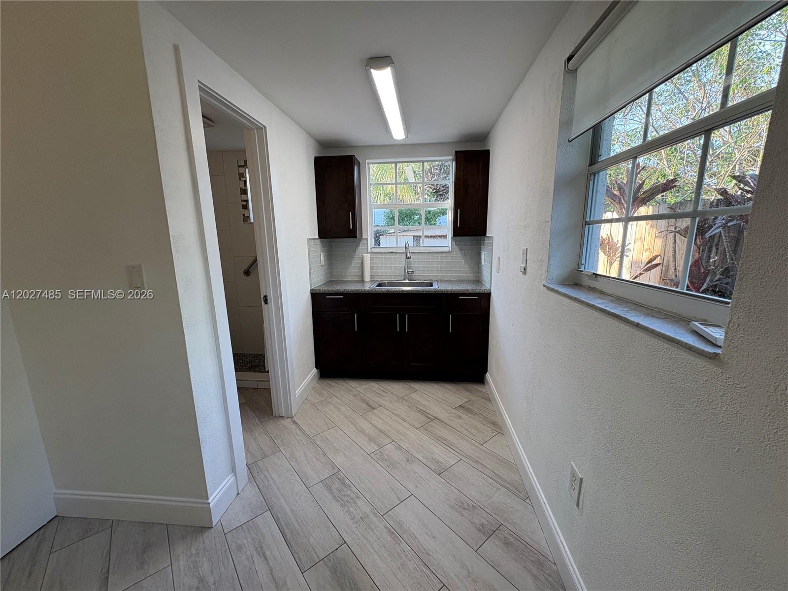 6753 Southwest 39th Terrace Miami, FL 33155 - Photo 4 of 9 Living/dinning area looking to kitchen