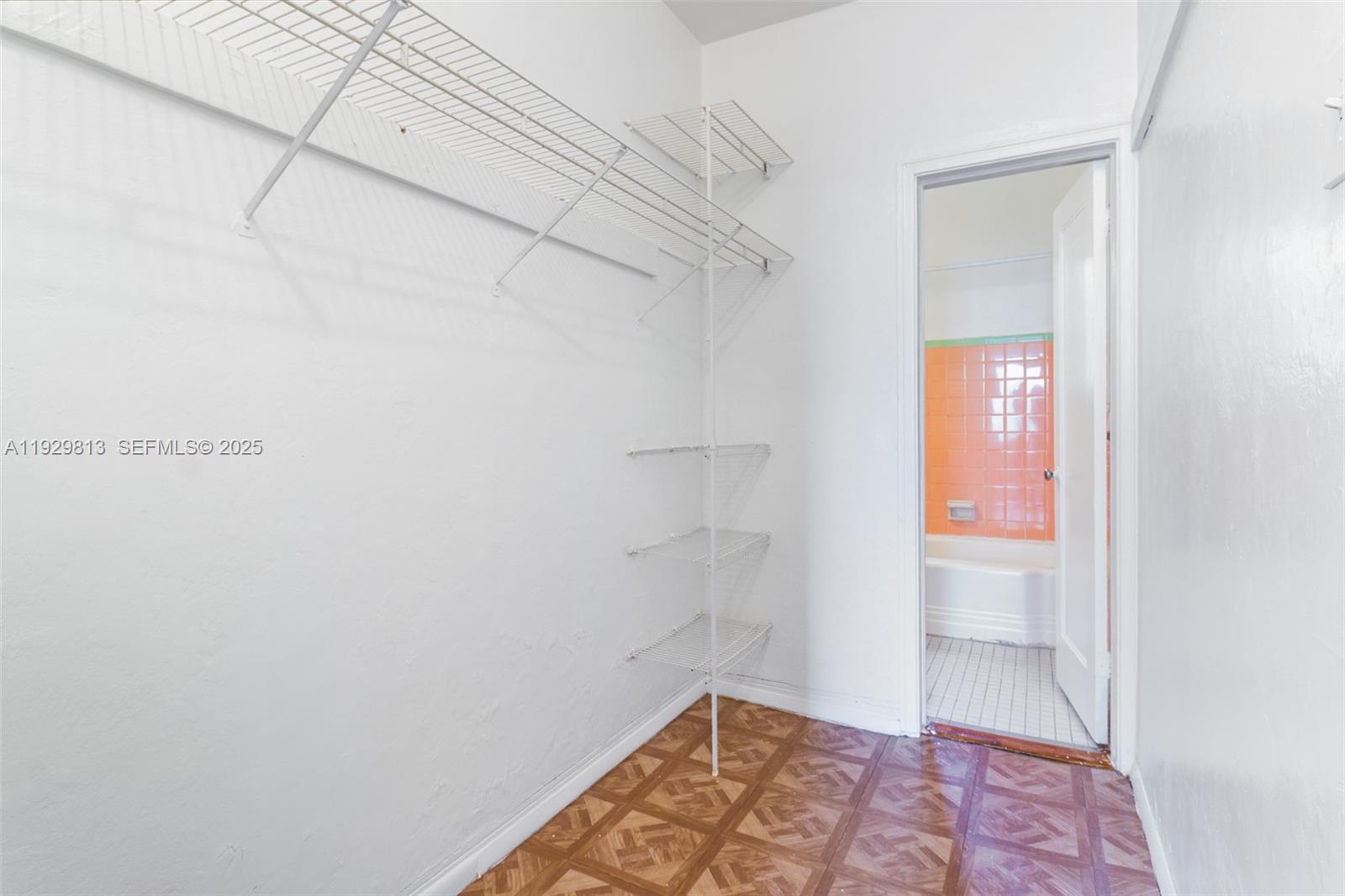 835 Alton Road, Unit 19 Miami Beach, FL 33139 - Photo 9 of 12 a bathroom with a window