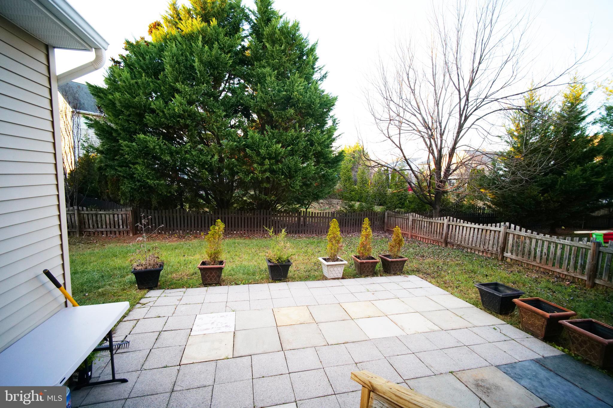 20203 Hopi Drive Ashburn, VA 20147 - Photo 17 of 20 Stone patio w/ planters for gardening