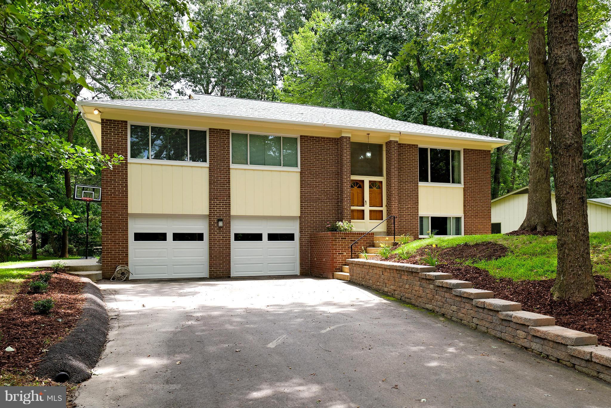 2407 Myrtle Lane Reston, VA 20191 - Photo 1 of 28 a view of a house with a yard and large tree