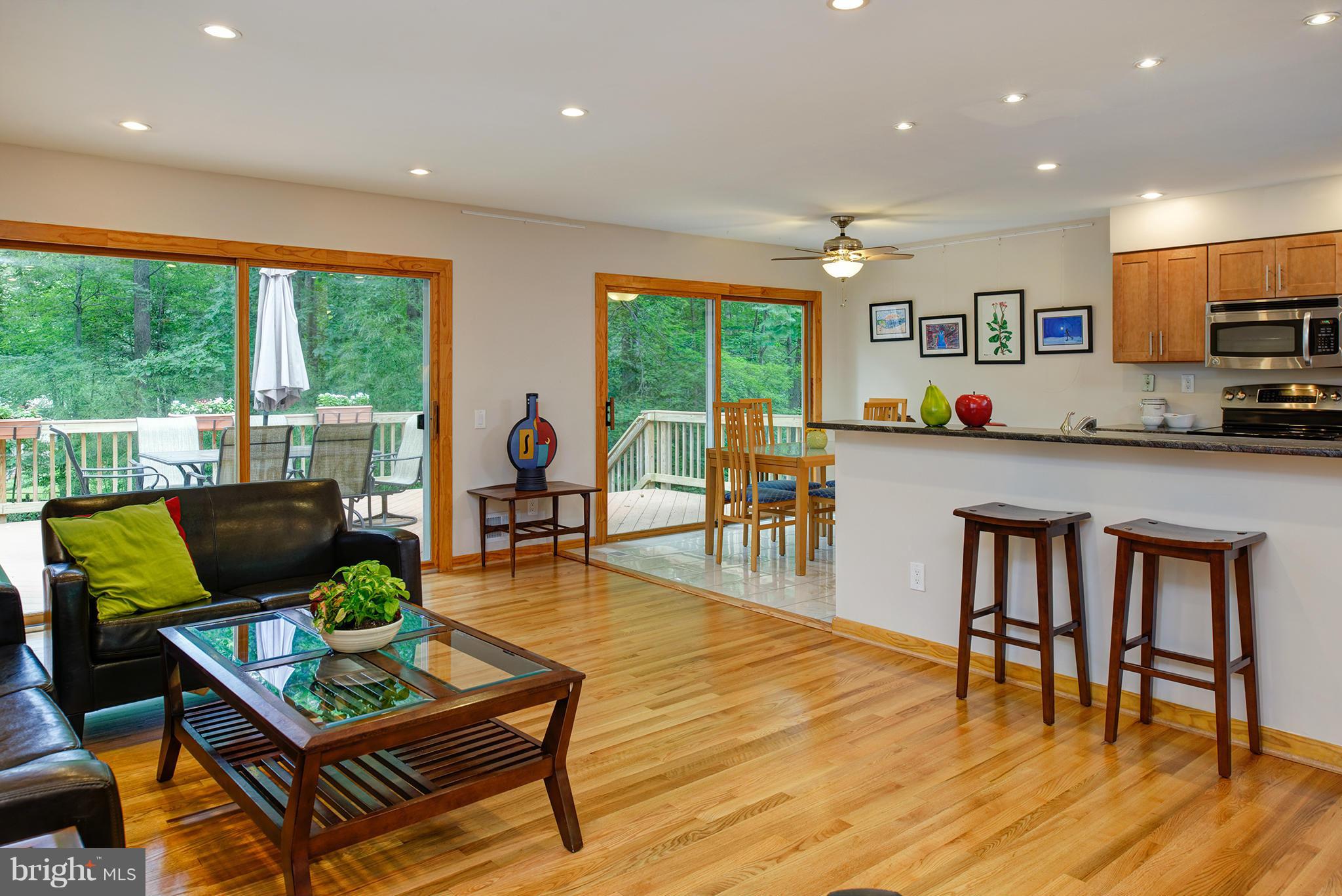 2407 Myrtle Lane Reston, VA 20191 - Photo 12 of 28 a living room with furniture a dining table and a large window