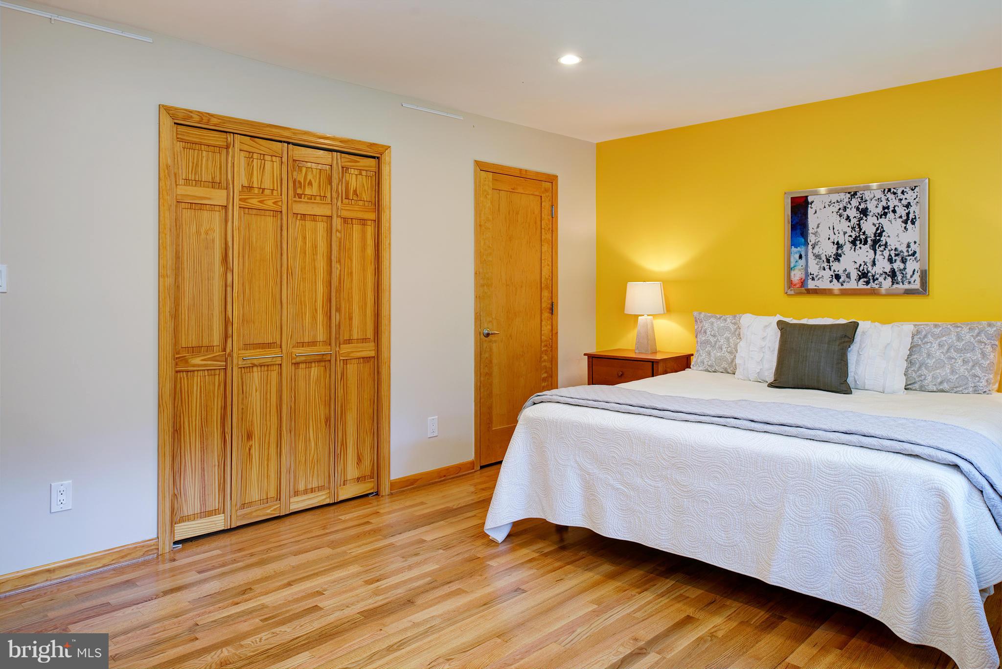 2407 Myrtle Lane Reston, VA 20191 - Photo 13 of 28 a bedroom with a bed and wooden floor