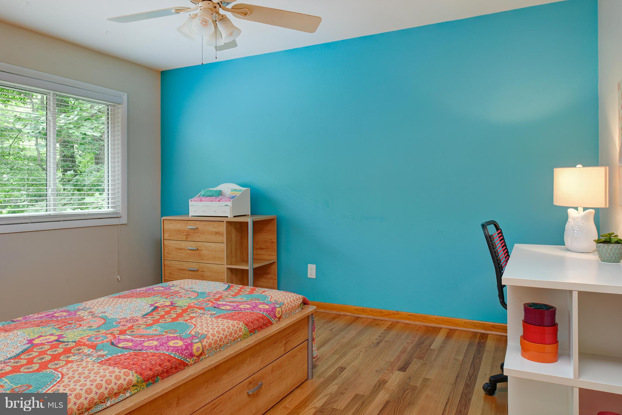 2407 Myrtle Lane Reston, VA 20191 - Photo 15 of 28 a bedroom with a bed and a chandelier