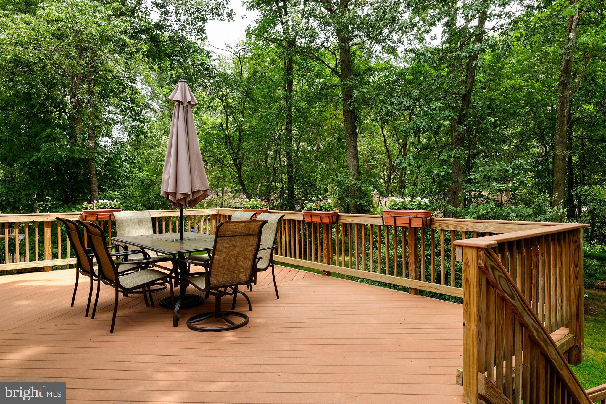 2407 Myrtle Lane Reston, VA 20191 - Photo 22 of 28 a view of a roof deck with table and chairs and wooden floor