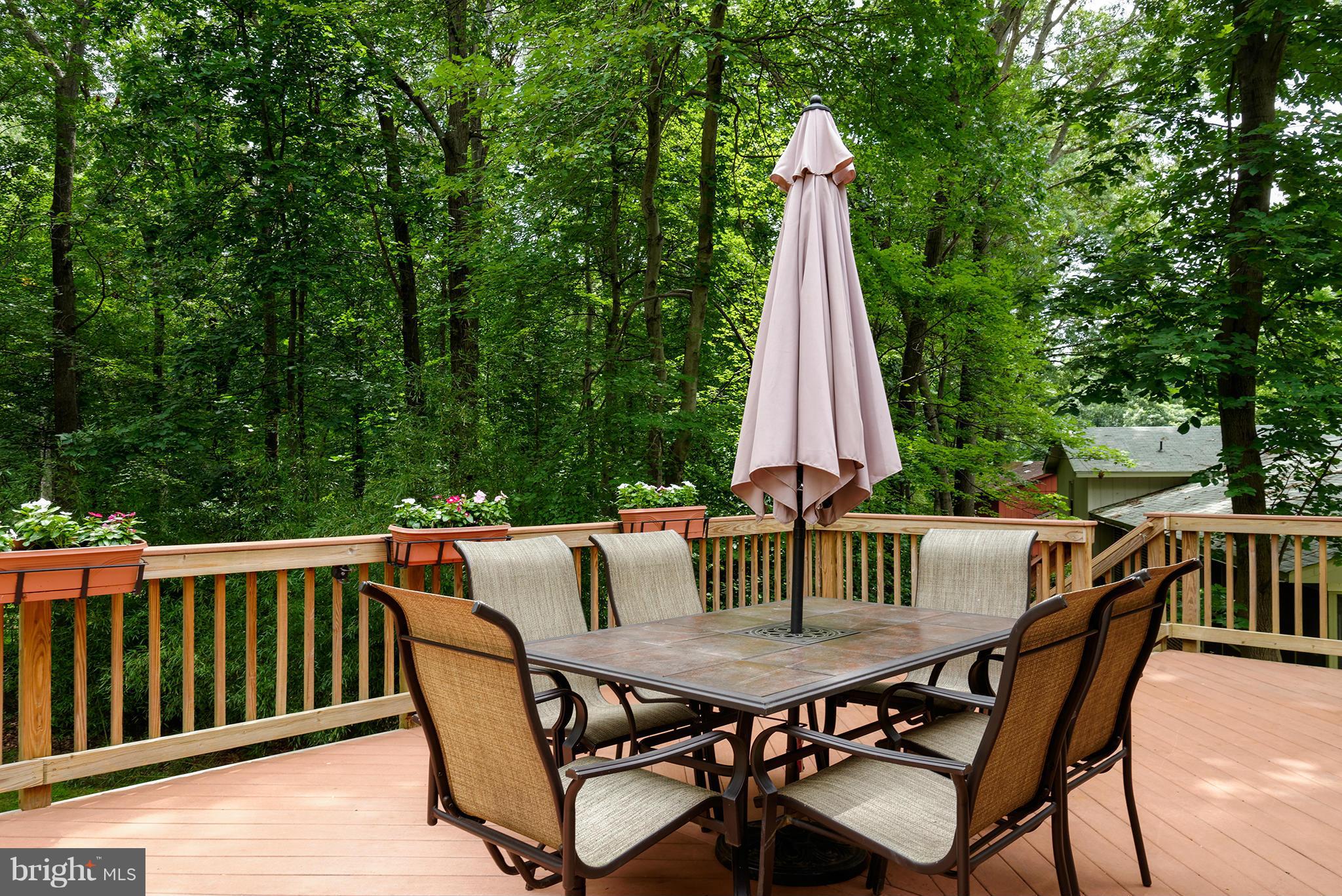 2407 Myrtle Lane Reston, VA 20191 - Photo 23 of 28 a view of a dining table and chairs on the deck