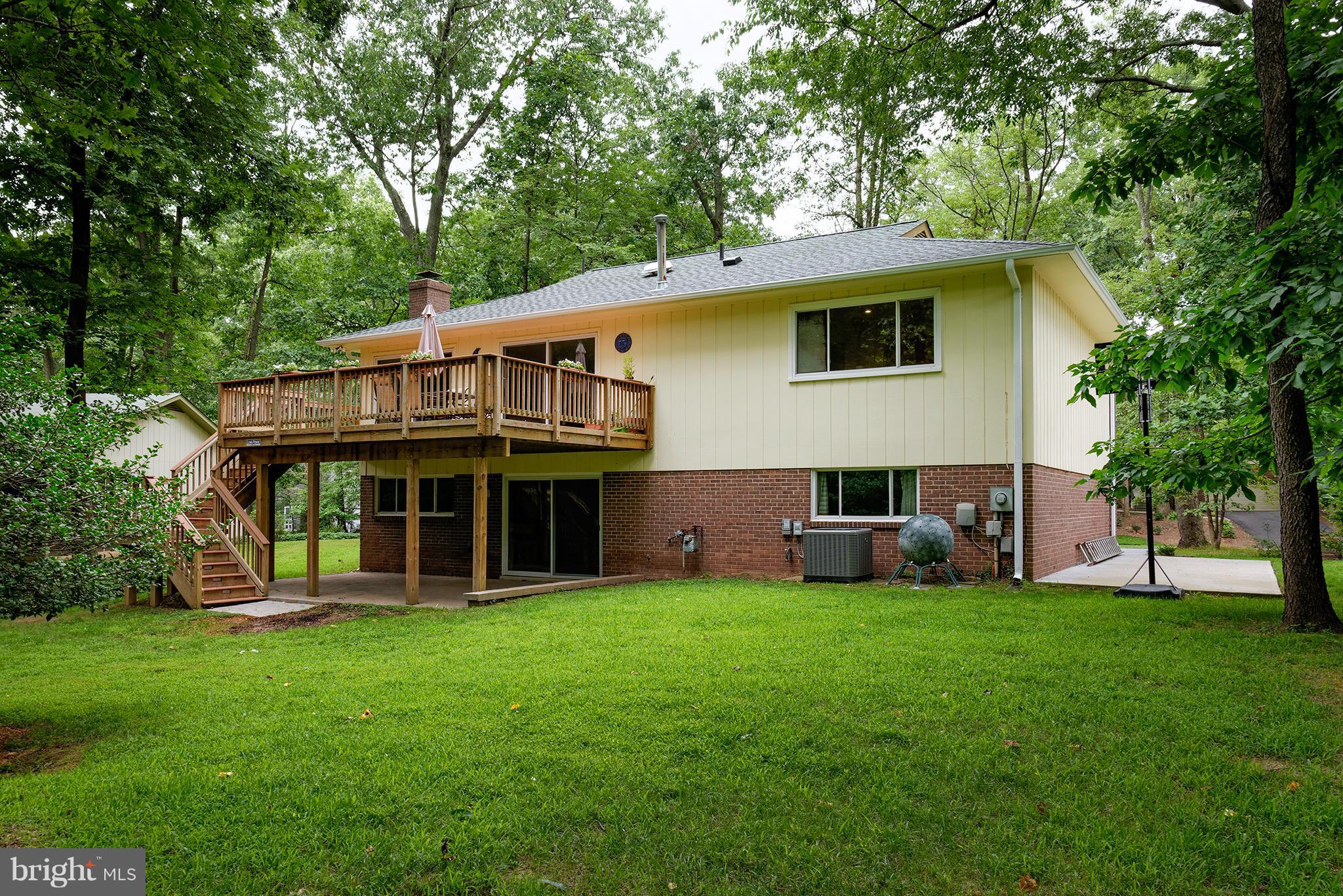 2407 Myrtle Lane Reston, VA 20191 - Photo 25 of 28 a view of a house with a yard and sitting area