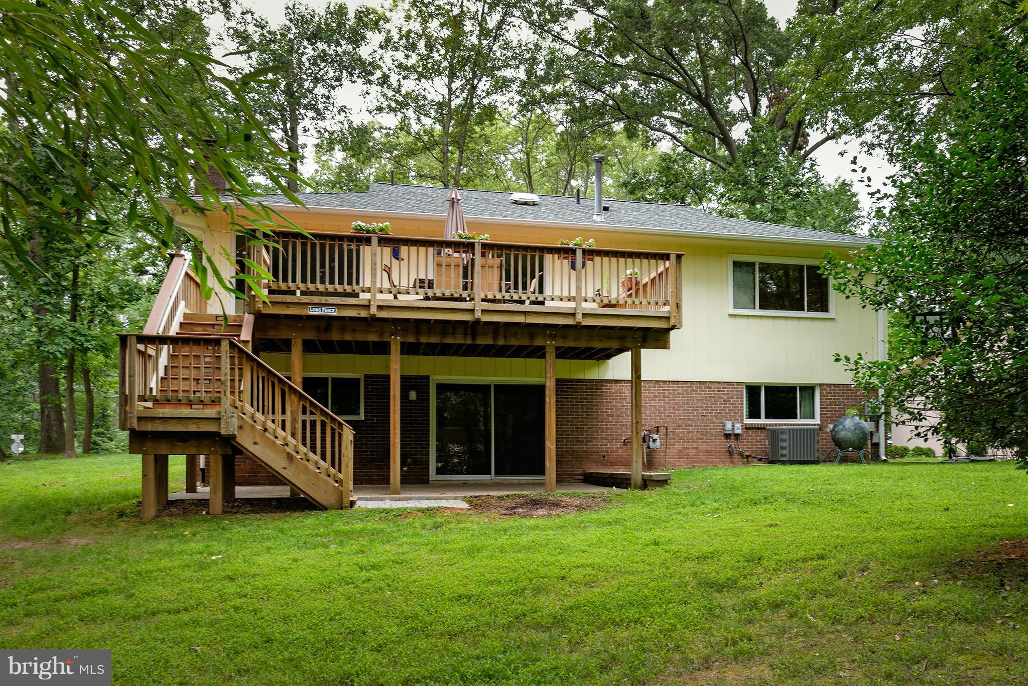 2407 Myrtle Lane Reston, VA 20191 - Photo 27 of 28 a view of a house with a backyard porch and sitting area