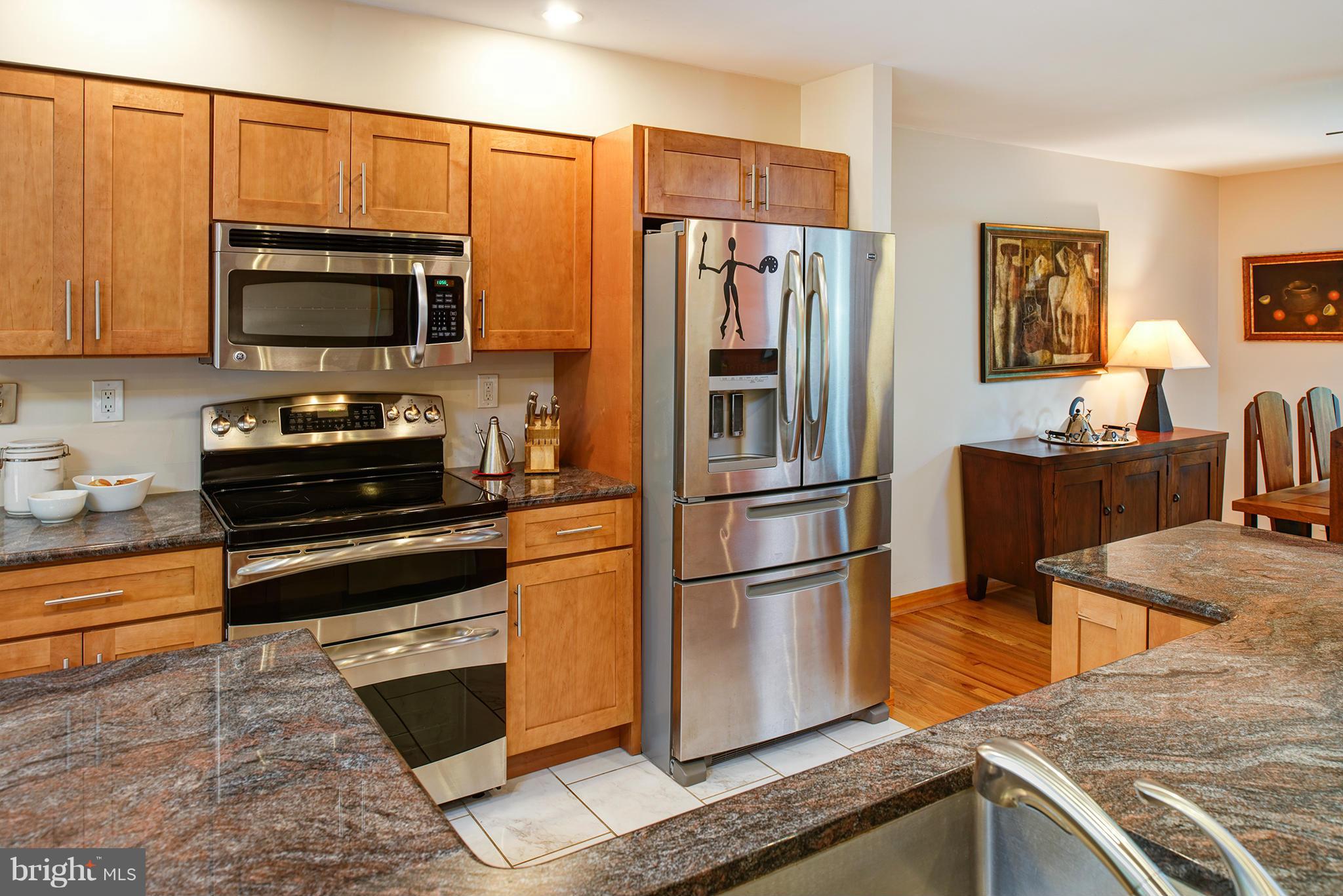 2407 Myrtle Lane Reston, VA 20191 - Photo 4 of 28 a kitchen with stainless steel appliances granite countertop a refrigerator stove and microwave