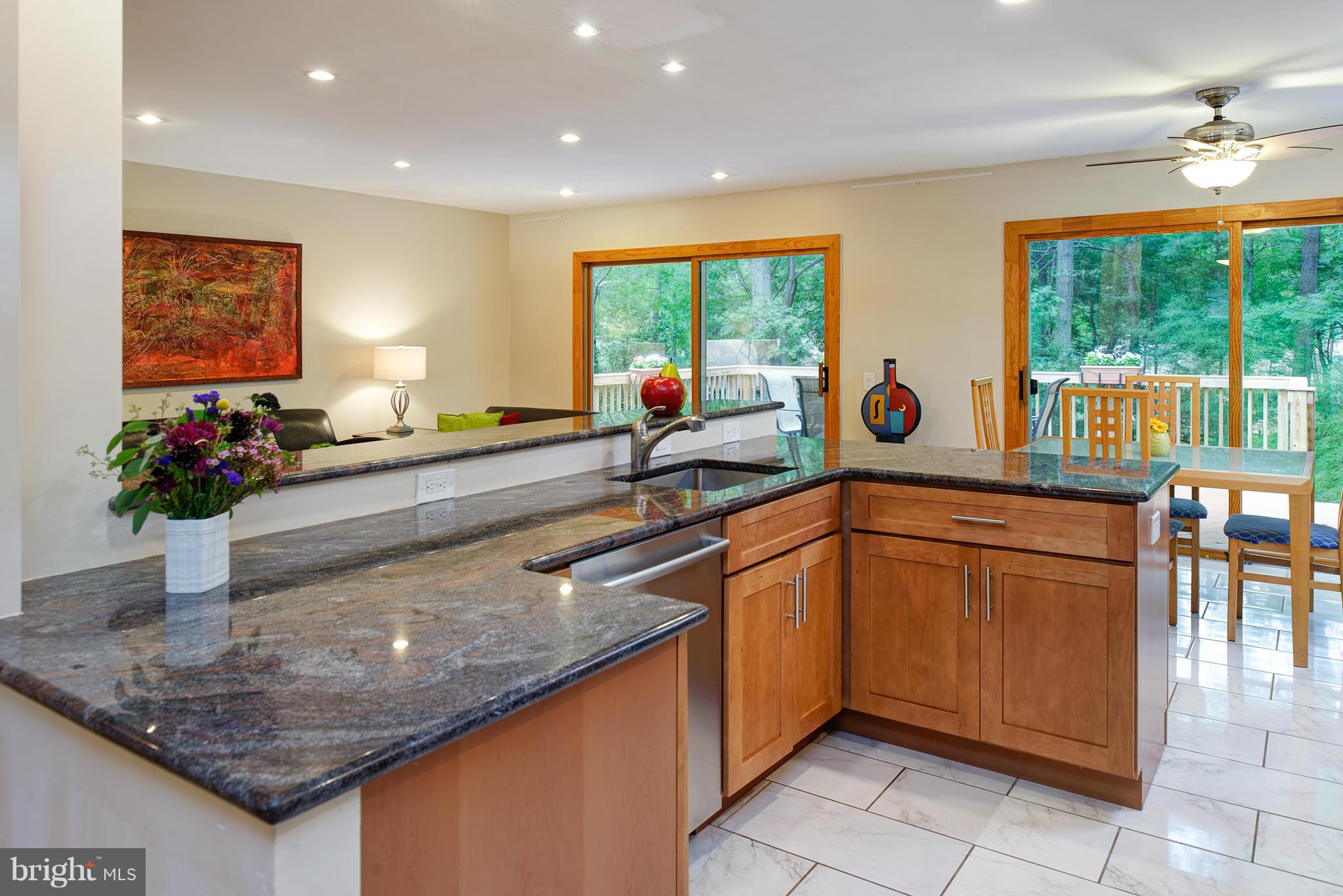 2407 Myrtle Lane Reston, VA 20191 - Photo 5 of 28 a kitchen with stainless steel appliances granite countertop sink stove and a granite counter top