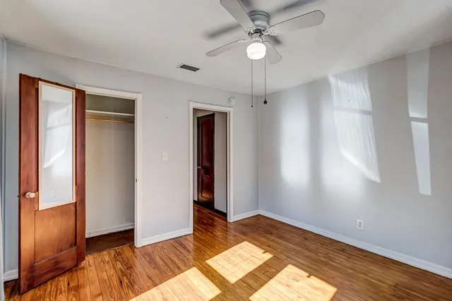 a front view of a house with a glass door and glass door