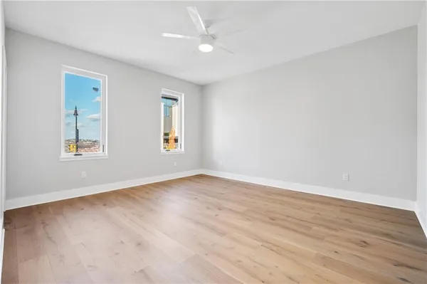 a view of hallway with wooden floor