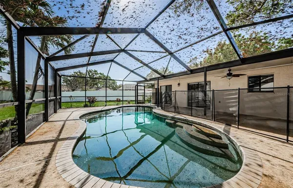 a view of a swimming pool with a patio