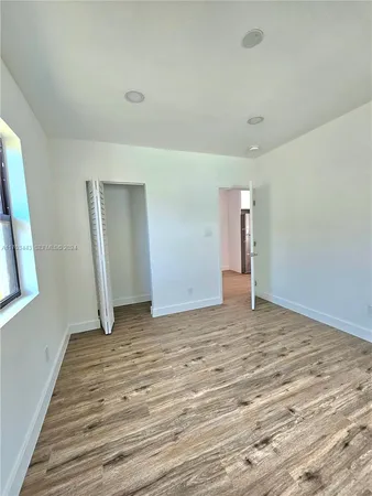 a view of an empty room and window