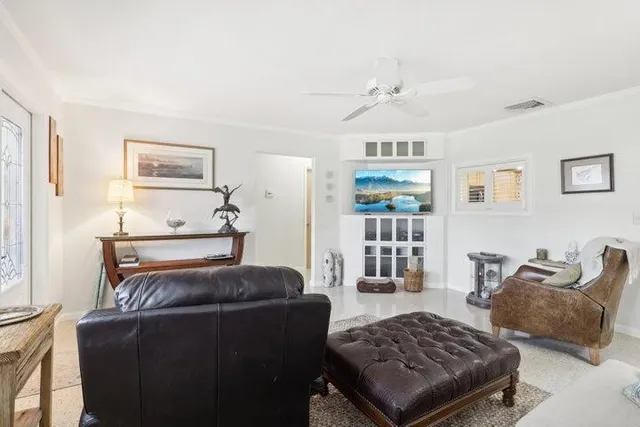 a living room with furniture rug and window