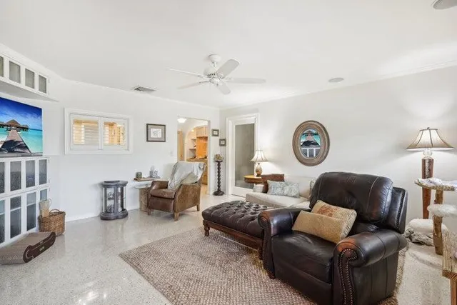 a living room with furniture and a window