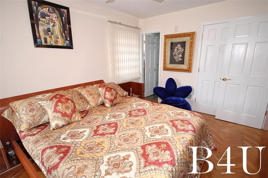 2268 56th Drive Brooklyn, NY 11234 - Photo 11 of 20 a bedroom with a bed and painting on the wall