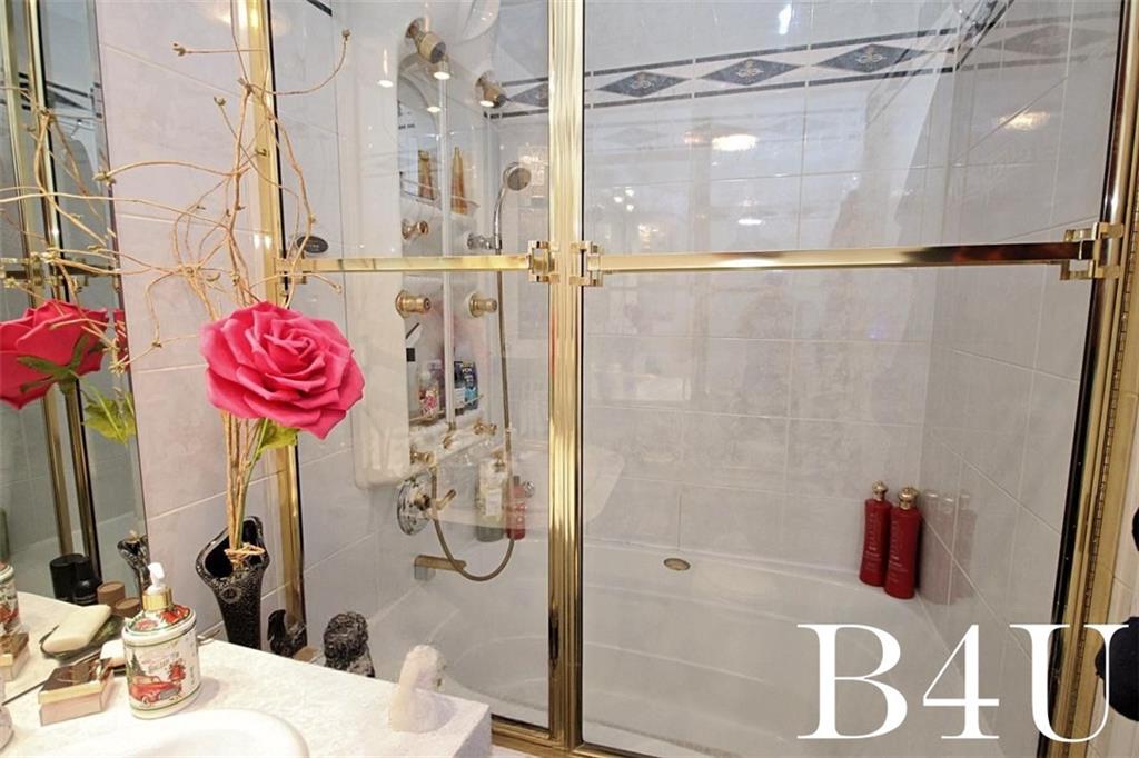 2268 56th Drive Brooklyn, NY 11234 - Photo 15 of 20 a bathroom with a sink and shower