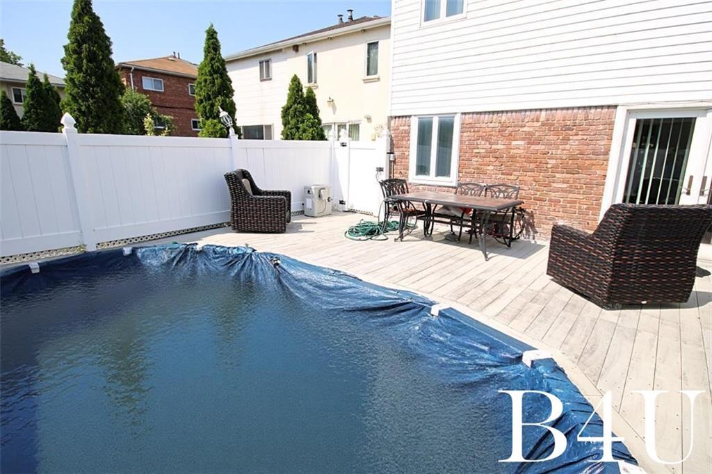 2268 56th Drive Brooklyn, NY 11234 - Photo 20 of 20 a view of swimming pool with seating space