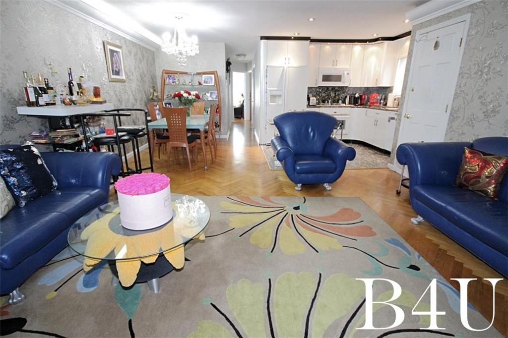 2268 56th Drive Brooklyn, NY 11234 - Photo 5 of 20 a living room with furniture and a table