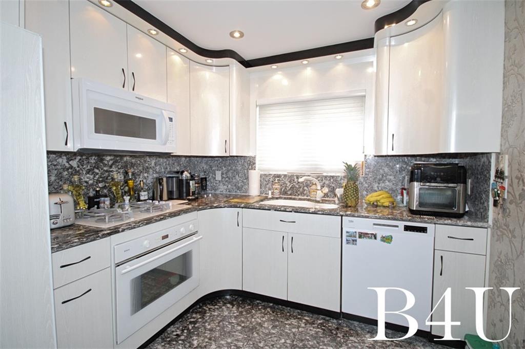 2268 56th Drive Brooklyn, NY 11234 - Photo 8 of 20 a kitchen with a sink cabinets and appliances