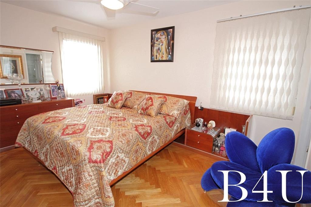 2268 56th Drive Brooklyn, NY 11234 - Photo 10 of 20 a bedroom with bed and a couch