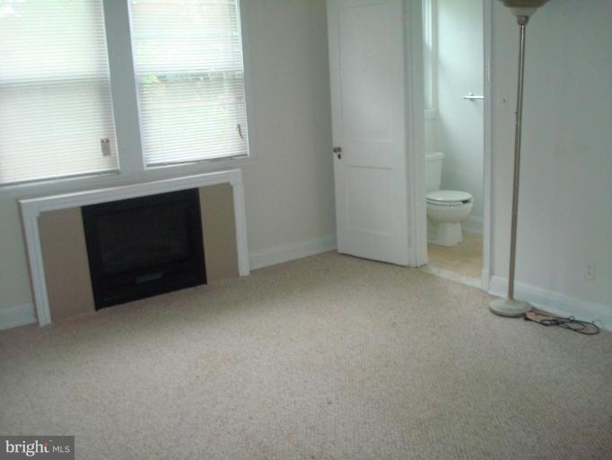 1536 Roundhill Road Baltimore, MD 21218 - Photo 17 of 26 Master Bedrm pic w/ bath and fireplace