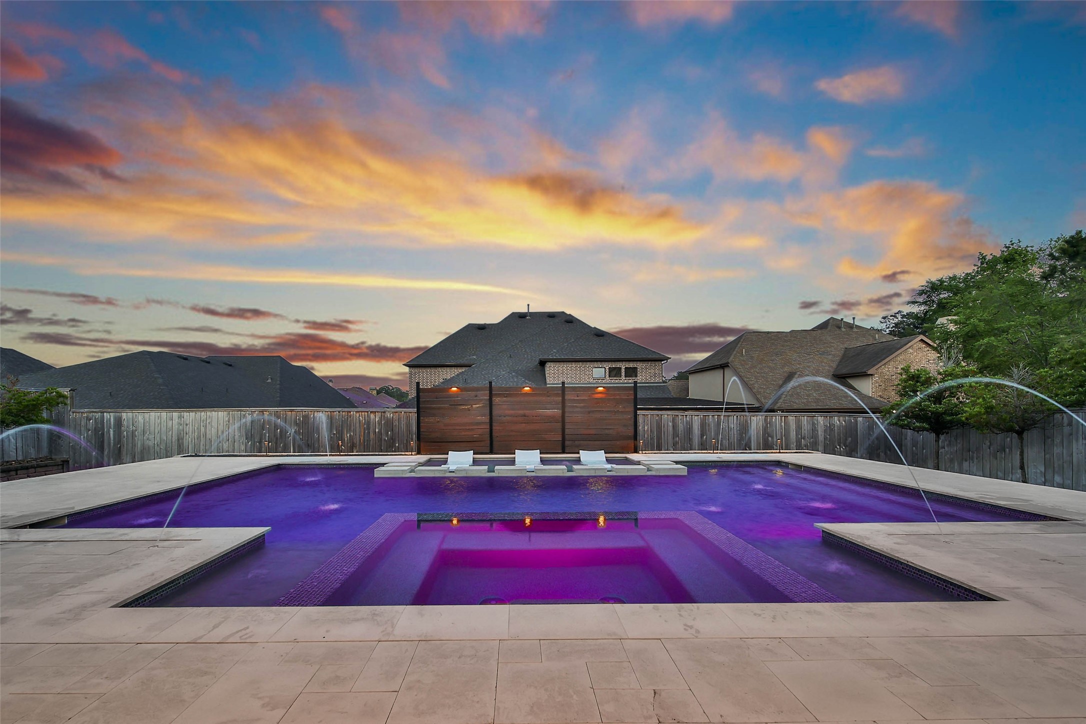 1015 Oak Briar Lane Conroe, TX 77384 - Photo 45 of 50 a view of swimming pool with a table and chairs under an umbrella