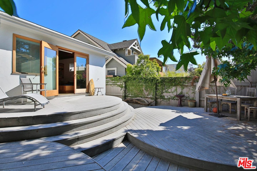 48 Dudley Avenue Venice, CA 90291 - Photo 16 of 16 a view of a patio with table and chairs with wooden floor and fence