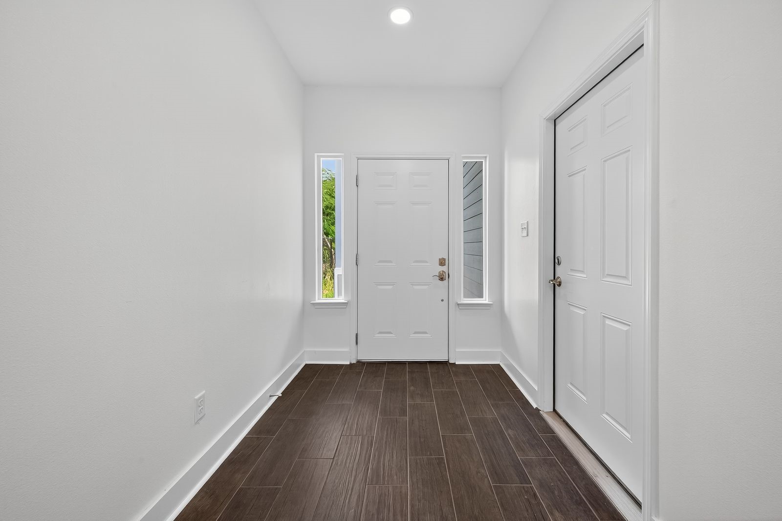 714 Zoe Street Houston, TX 77020 - Photo 2 of 34 a view of a small space with wooden floor and a window