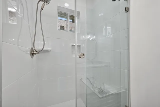 a balcony with wooden floor and fence