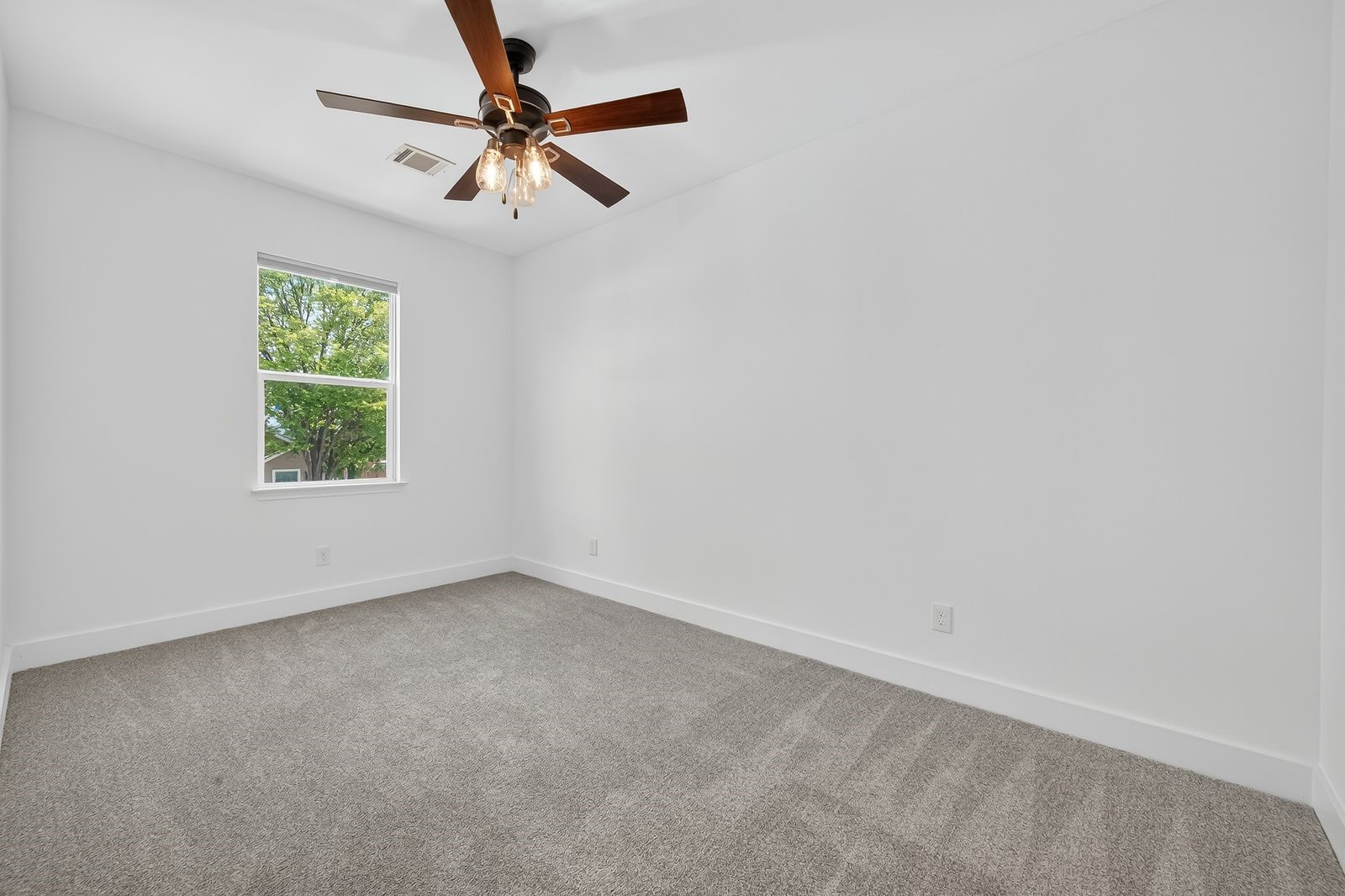 714 Zoe Street Houston, TX 77020 - Photo 28 of 34 an empty room with a window and a fan
